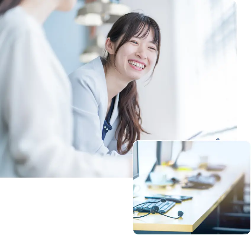 笑顔で話すスッタフの画像